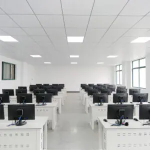 Empty computer lab with rows of desks